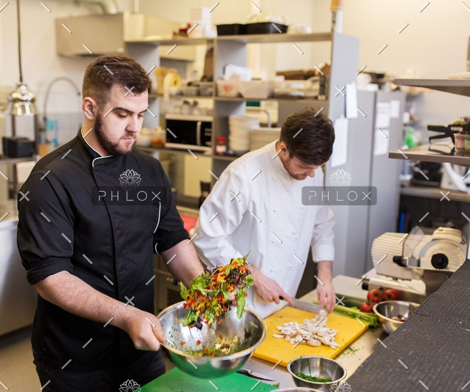 demo-attachment-56-chef-and-cook-cooking-food-at-restaurant-kitchen-P5WACEM